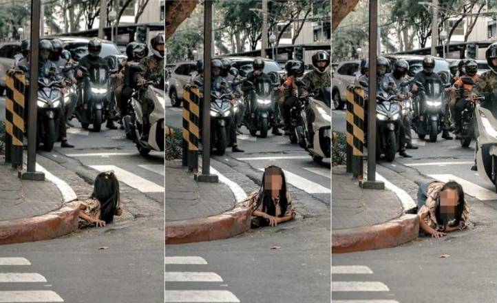 信用网怎么注册_女子从菲律宾闹市排水道爬出信用网怎么注册，画面惊悚像恐怖电影